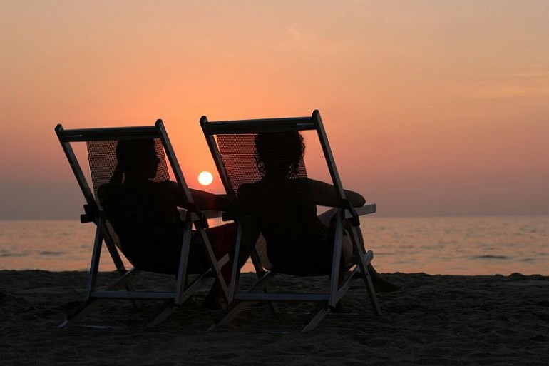 52_9 sunset beach couple chairs resized Beach Fun Gallery Image